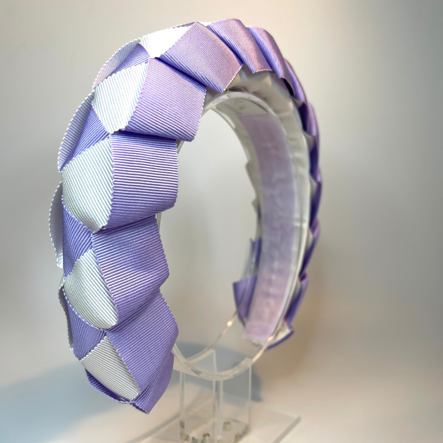 lilac and white ribbon woven and sitting on a padded headband lined in lilac velvet ribbon