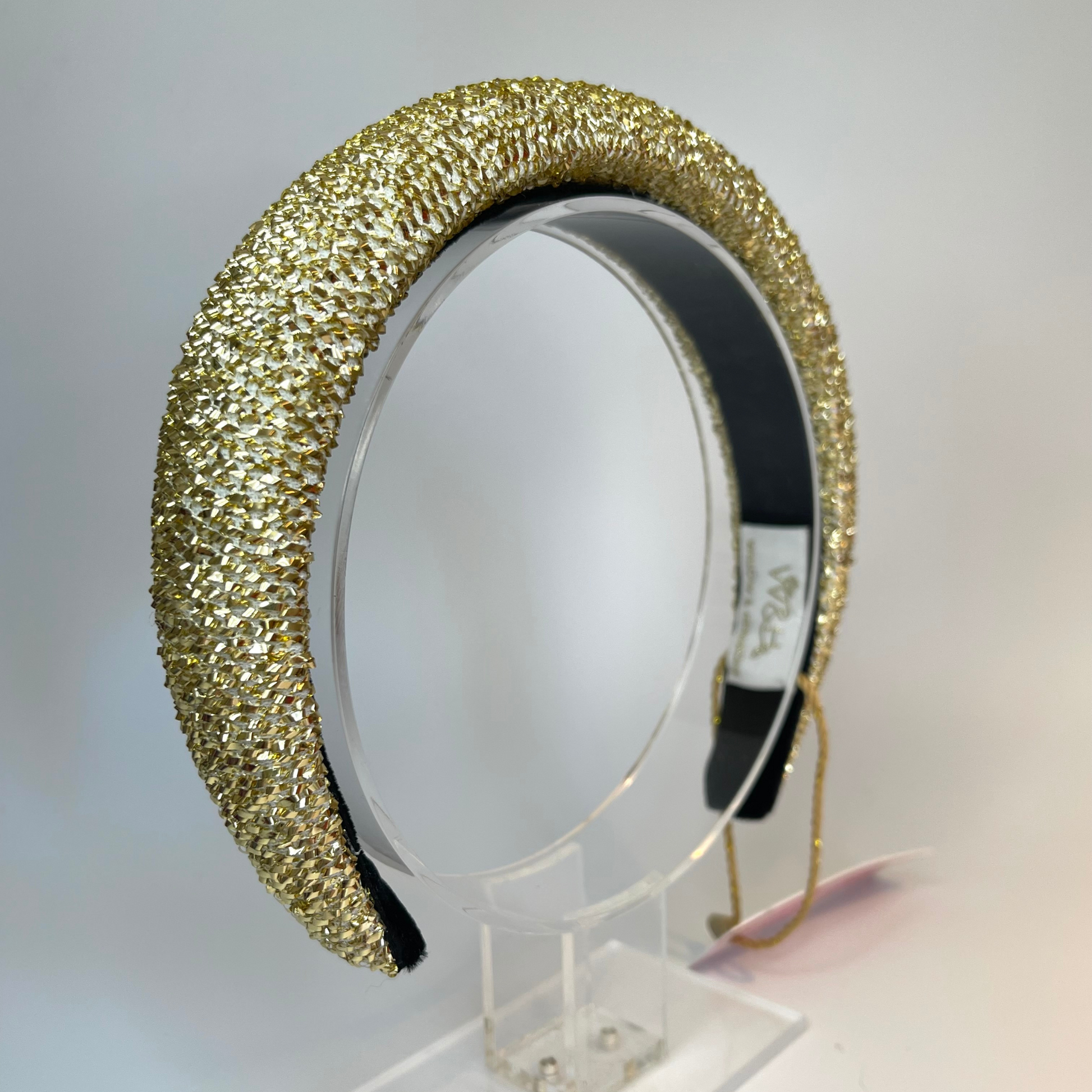 1/2 inch gold tinsel padded headband lined with velvet ribbon.