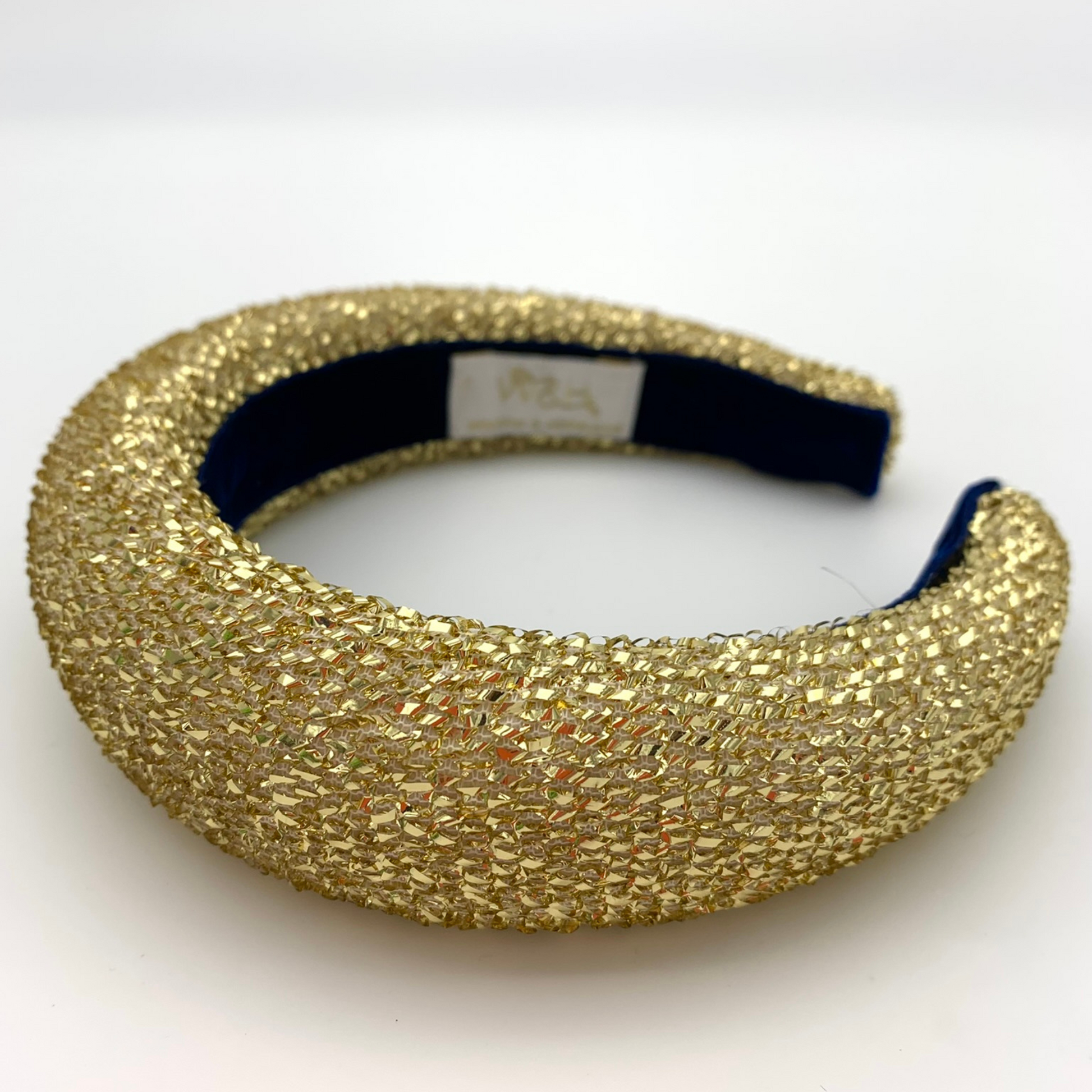 Gold tinsel lamè padded headband lined with velvet ribbon.