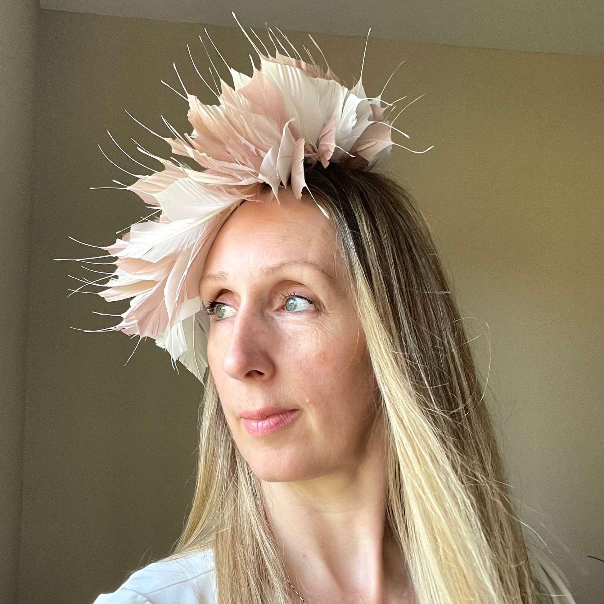 blush and white feather hat